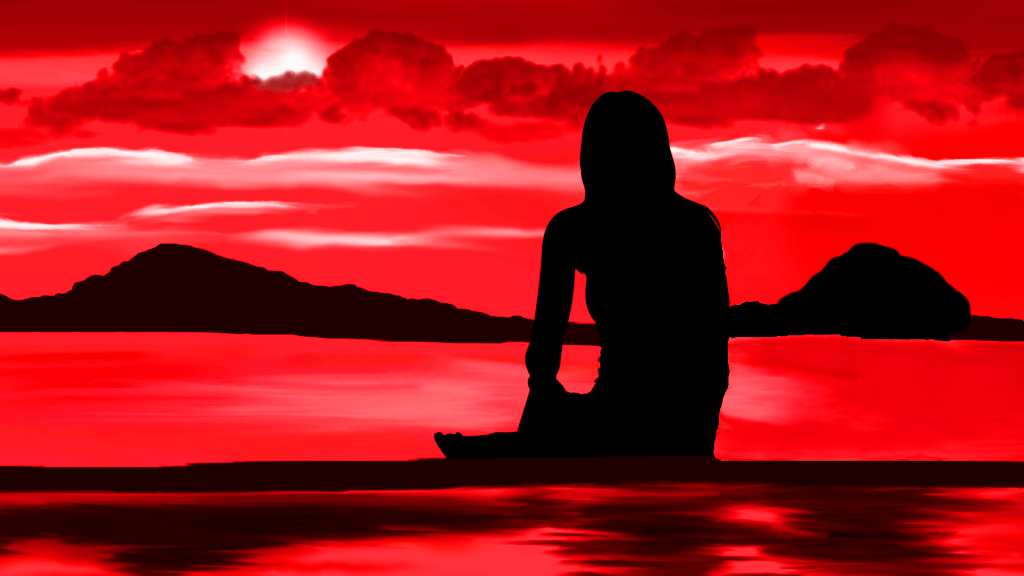 MindTuning, eine Frau am Strand schaut in den Sonnenuntergang